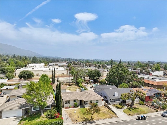 drone / aerial view featuring a mountain view and a residential view