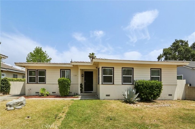 ranch-style home featuring fence, a front yard, and crawl space