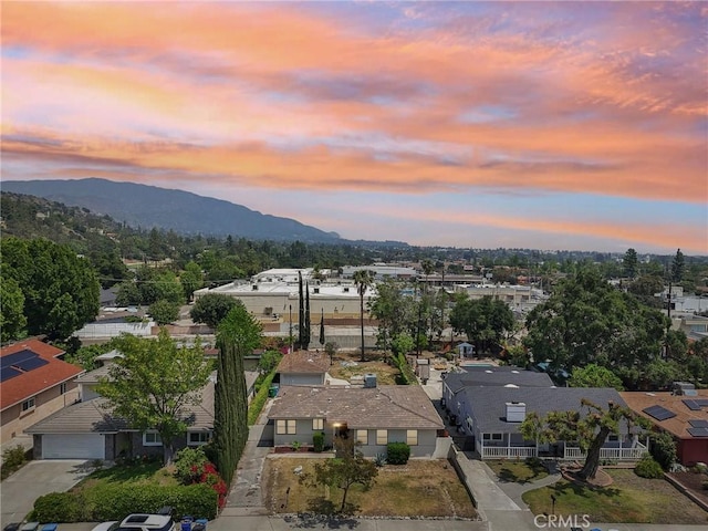 aerial view at dusk with a residential view and a mountain view