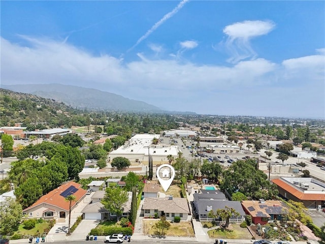birds eye view of property featuring a mountain view