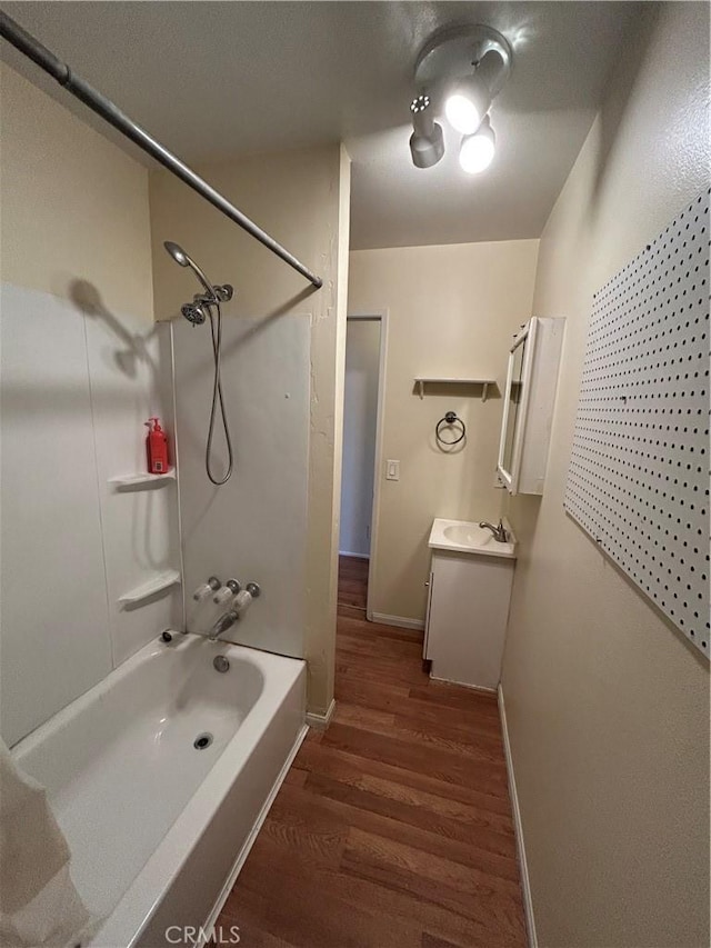 3755 Brockton Ave Unit 1-4, Riverside, CA 92501 - full bathroom featuring baseboards, vanity, shower / tub combination, and wood finished floors