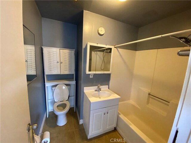 3755 Brockton Ave Unit 1-4, Riverside, CA 92501 - bathroom with vanity, bathtub / shower combination, toilet, tile patterned floors, and baseboards