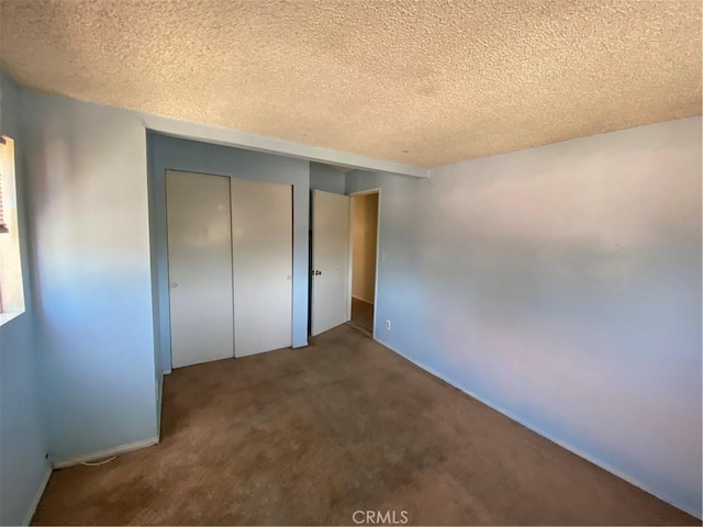 3755 Brockton Ave Unit 1-4, Riverside, CA 92501 - unfurnished bedroom with carpet flooring, a textured ceiling, and a closet