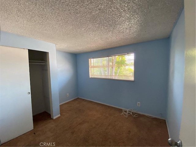 3755 Brockton Ave Unit 1-4, Riverside, CA 92501 - unfurnished bedroom featuring carpet floors, a textured ceiling, and a closet