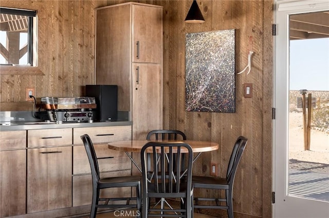 dining room with wooden walls