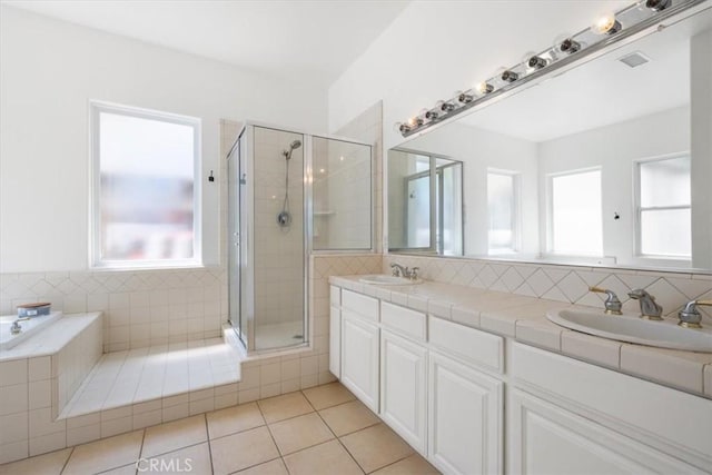 1050 Sleepy Hollow Rd, Paso Robles, CA 93446 - full bath with tile patterned flooring, a stall shower, double vanity, and tiled tub