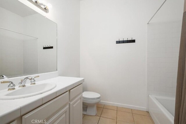 1050 Sleepy Hollow Rd, Paso Robles, CA 93446 - full bathroom featuring tile patterned flooring, toilet, vanity, shower / bath combo with shower curtain, and baseboards