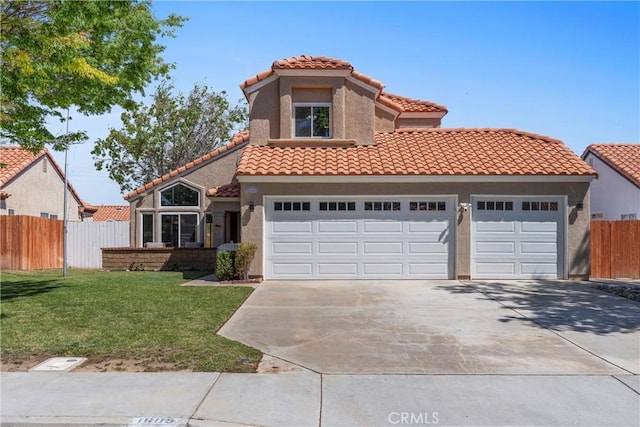 mediterranean / spanish-style home featuring fence, a tile roof, a front lawn, stucco siding, and driveway