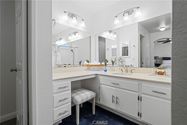 full bath with vanity, ensuite bathroom, and ceiling fan