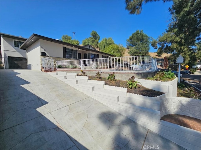 exterior space featuring stucco siding