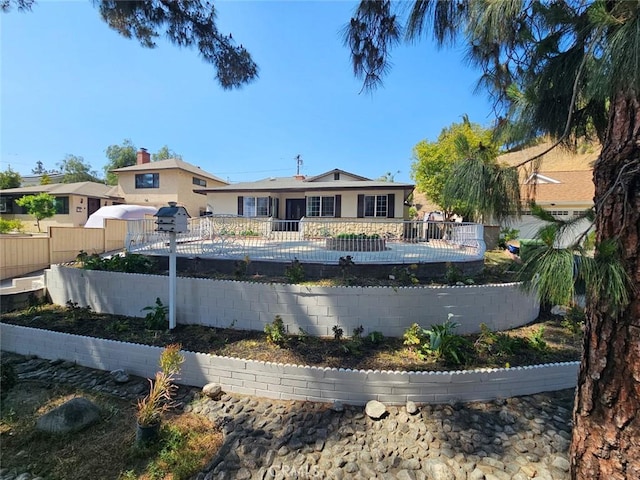 exterior space with fence private yard and a pool