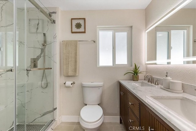 9951 Glencrest Cir, Sun Valley, CA 91504 - bathroom featuring a marble finish shower, toilet, double vanity, and baseboards