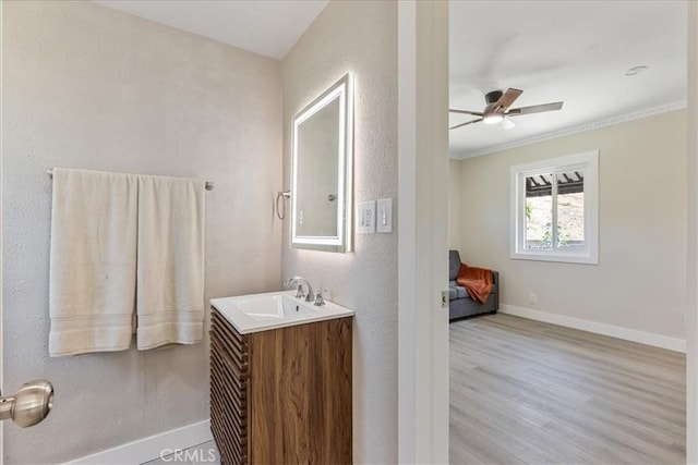 9951 Glencrest Cir, Sun Valley, CA 91504 - bathroom with a ceiling fan, wood finished floors, baseboards, vanity, and ornamental molding