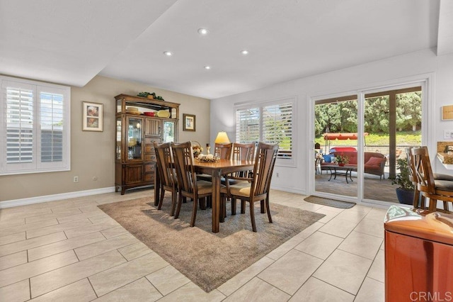 dining area with recessed lighting, baseboards, and light tile patterned flooring