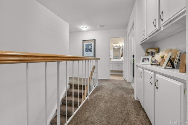 hall featuring carpet floors
