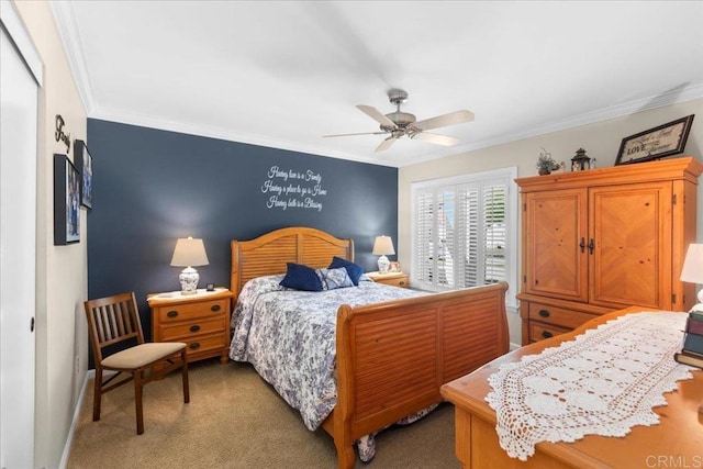 bedroom featuring crown molding, ceiling fan, and carpet