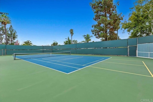 view of sport court featuring community basketball court and fence