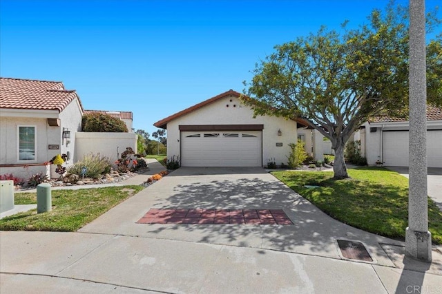 ranch-style house with an attached garage, driveway, a front yard, and stucco siding