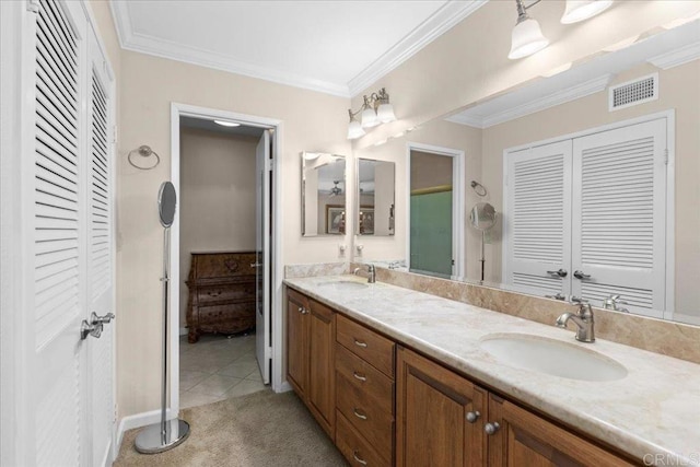 bathroom featuring double vanity, visible vents, a sink, and a closet