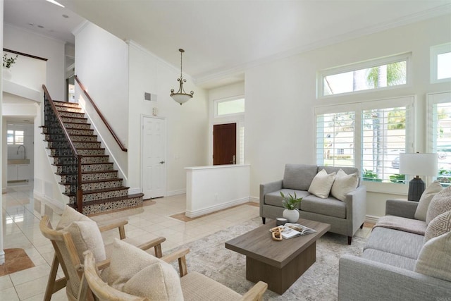1719 Willowhaven Rd, Encinitas, CA 92024 - living room with a towering ceiling, a wealth of natural light, light tile patterned floors, and ornamental molding
