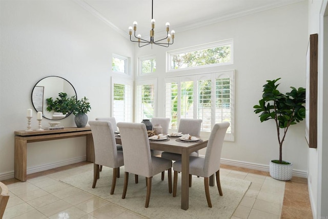 1719 Willowhaven Rd, Encinitas, CA 92024 - dining area with light tile patterned floors, a towering ceiling, and a notable chandelier