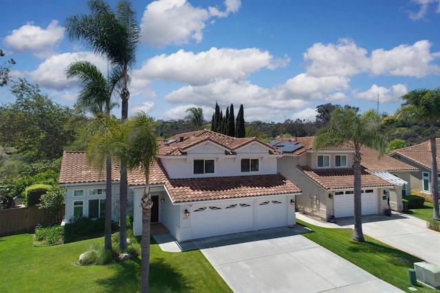 1719 Willowhaven Rd, Encinitas, CA 92024 - mediterranean / spanish home with driveway, stucco siding, a tile roof, and a front yard