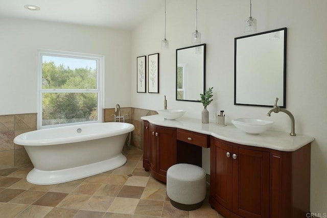 1719 Willowhaven Rd, Encinitas, CA 92024 - bathroom with a sink, tile walls, a wainscoted wall, a soaking tub, and double vanity