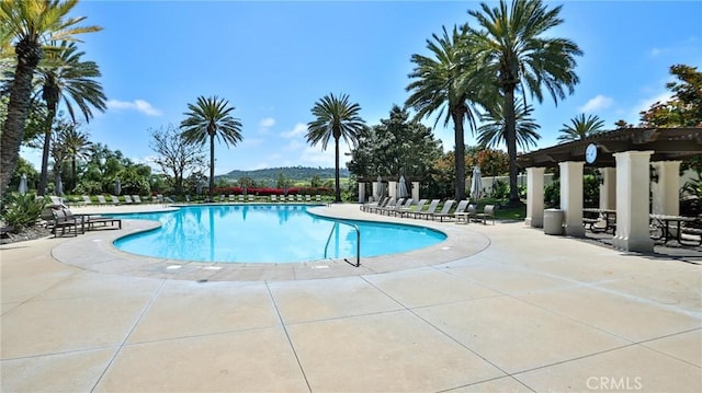 community pool with a patio area