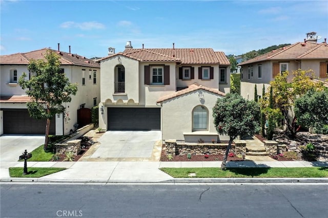 mediterranean / spanish-style house with a residential view, a garage, stucco siding, a tiled roof, and driveway
