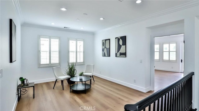 sitting room featuring recessed lighting, baseboards, wood finished floors, visible vents, and ornamental molding