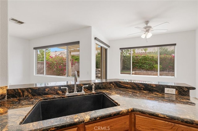 37388 Medjool, Palm Desert, CA 92211 - kitchen featuring a sink, dark stone countertops, and healthy amount of natural light