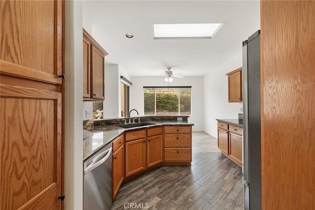 37388 Medjool, Palm Desert, CA 92211 - kitchen with stainless steel appliances, a sink, dark wood-type flooring, brown cabinetry, and recessed lighting
