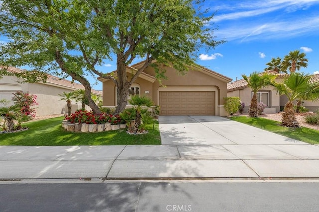 37388 Medjool, Palm Desert, CA 92211 - view of front of home with a garage, concrete driveway, stucco siding, a front yard, and a tiled roof