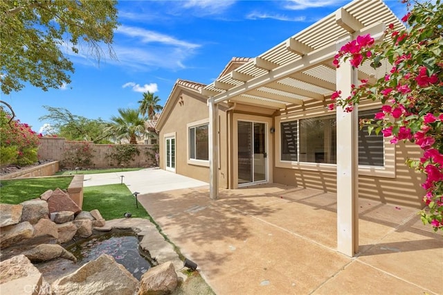37388 Medjool, Palm Desert, CA 92211 - fenced backyard with a pergola, a patio area, and a garden pond