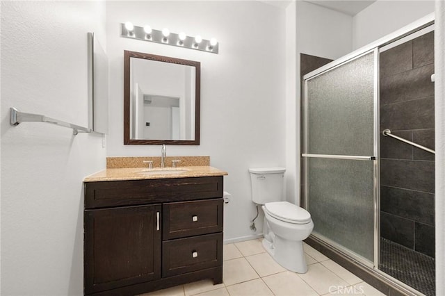 37388 Medjool, Palm Desert, CA 92211 - bathroom featuring vanity, a shower stall, toilet, and tile patterned flooring