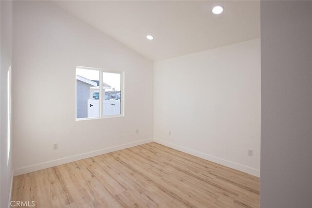 1402 E Luray St, Long Beach, CA 90807 - empty room with recessed lighting, baseboards, lofted ceiling, and wood finished floors