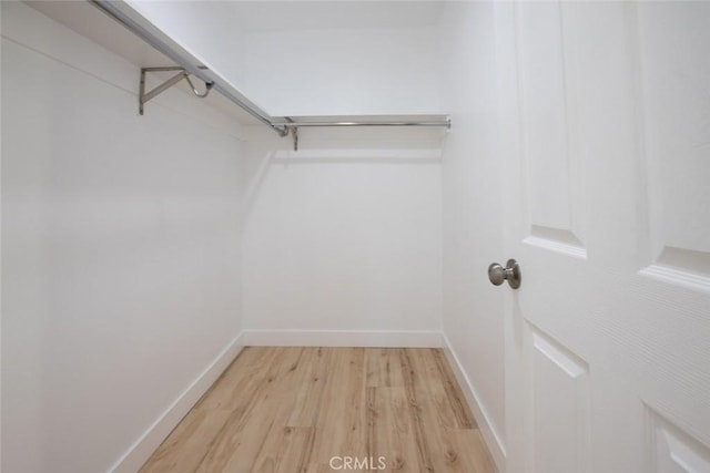 1402 E Luray St, Long Beach, CA 90807 - walk in closet with light wood-style flooring