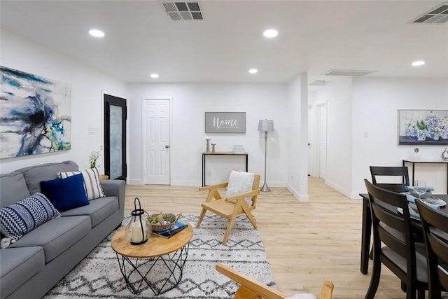 1402 E Luray St, Long Beach, CA 90807 - living area with light wood-style floors, baseboards, recessed lighting, and visible vents