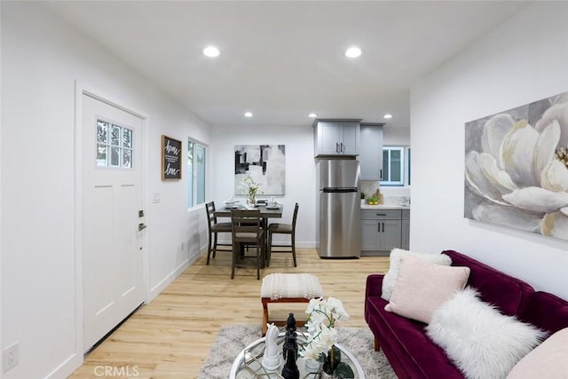 1402 E Luray St, Long Beach, CA 90807 - living room featuring recessed lighting, light wood-style flooring, and baseboards