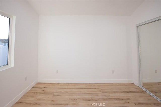 1402 E Luray St, Long Beach, CA 90807 - empty room featuring light wood-style floors and baseboards