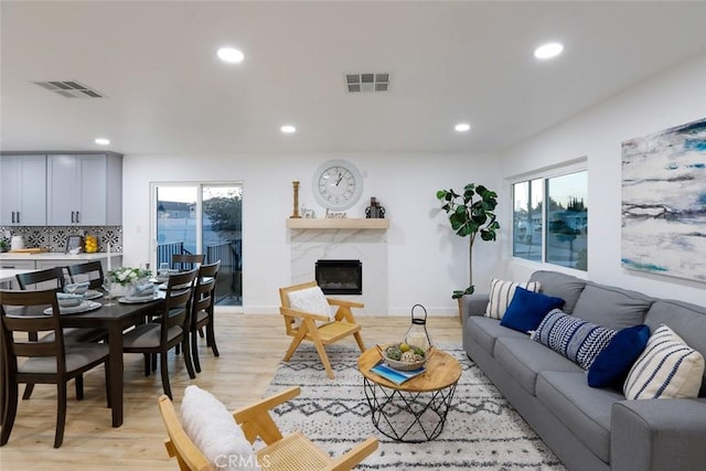 1402 E Luray St, Long Beach, CA 90807 - living room with recessed lighting, visible vents, and light wood-style flooring