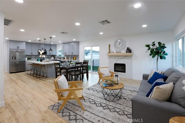 1402 E Luray St, Long Beach, CA 90807 - living area featuring recessed lighting, light wood-style flooring, and visible vents