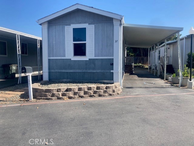 1885 E Bayshore Rd Unit 37, East Palo Alto, CA 94303 - manufactured / mobile home with an attached carport and asphalt driveway