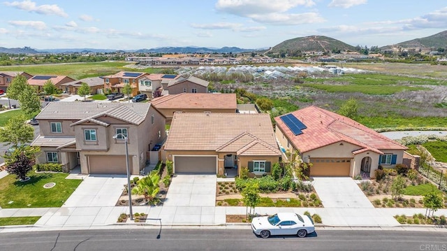 drone / aerial view featuring a mountain view and a residential view