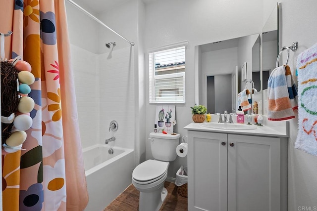 full bathroom with toilet, wood finished floors, shower / tub combo, and vanity