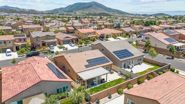 birds eye view of property with a mountain view and a residential view
