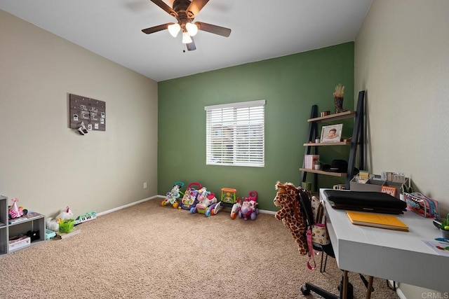 office area with carpet floors, ceiling fan, and baseboards