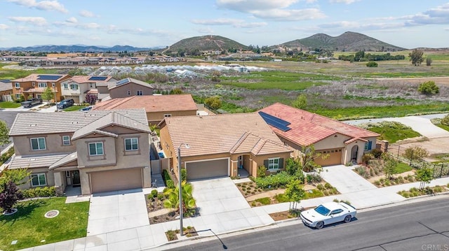 drone / aerial view with a residential view and a mountain view