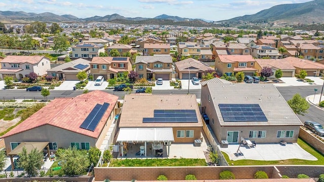 birds eye view of property with a mountain view and a residential view