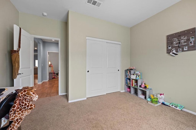 recreation room with carpet floors, baseboards, and visible vents